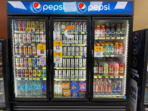 Snacks and cold drinks display inside Moorpark Express food mart